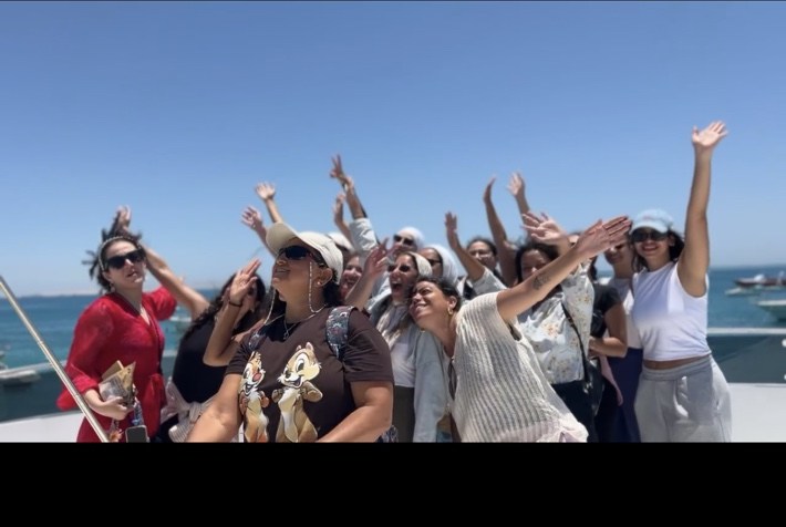Women together on the Red Sea shore during an UNLEASH retreat
